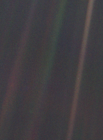 The Pale Blue Dot photograph showing Earth as a tiny point of light